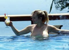 Abi Titmuss topless in a pool