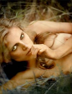 Malgosia Bela lying topless