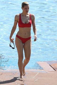 Michelle Hunziker in red bikini poolside