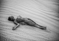 Marisa Papen lying fully nude at sand