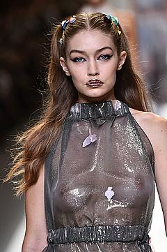 Gigi Hadid in see through dress runway image