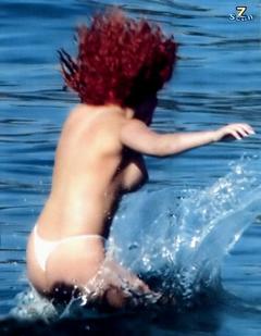Angela Sozio topless in a water paparazzi photo