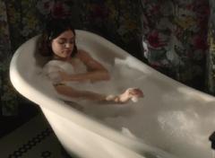 Lucy Hale naked in a bathtub scene from Life Sentence