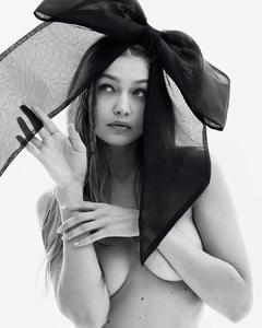 Gigi Hadid topless cover her breasts