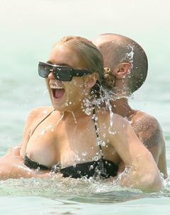 Lindsay Lohan nipple slip in bikini in Bahams