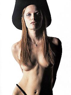 Rie Rasmussen topless in a hat