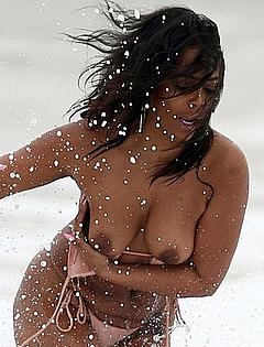 Sundy Carter topless on a beach