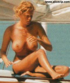 Italian actress Alessia Marcuzzi topless on a boat paparazzi photo