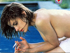Nastassja Kinski smoking topless poolside