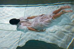 Sara Sampaio in see through dress in a water