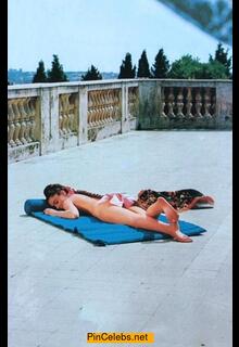 Italian singer Romina Power sunbathing naked but cover her ass
