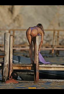 Kimberley Garner round ass in tiny purple bikini in Ibiza - August 15, 2026