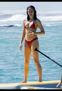Margaret Qualley in red bikini on the beach in Hawaii - November 03, 2025