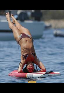 Dua Lipa doing paddleboard yoga in bikini in Ibiza - August 2025
