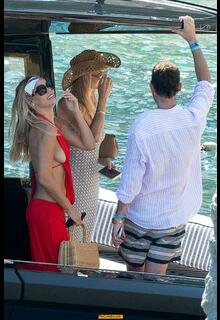 Brooks Nader sideboob in red dress at La Conca del Sogno - August 15, 2026