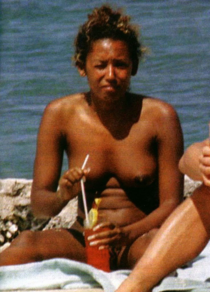 Melanie Brown nude tits on a beach. 