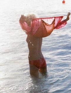 Allison Renner topless in a water