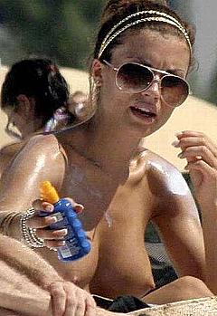 Oksana Andersson topless on a beach paparazzi photo
