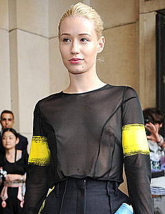Blonde Iggy Azalea in see through top at Maison Martin Margiela fashion show in Paris