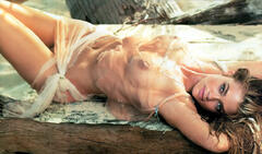 Denise Richards lying almost nude