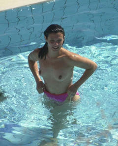 Kym Marsh topless in a pool paparazzi photo - August 2002