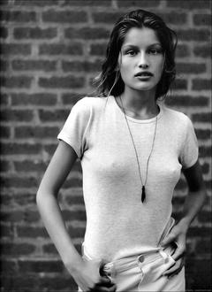 Young Laetitia Casta pokies in white t-shirt