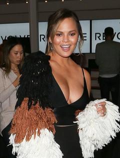 Chrissy Teigen shows cleavage