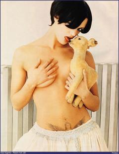 Asia Argento topless but covered for US Maxim Hot 100
