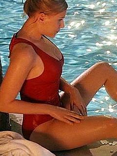 Scarlett Johansson poolside in red swimsuit in Scoop