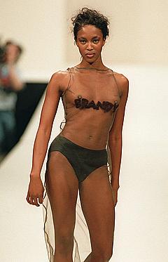 Naomi Campbell almost topless runway photo