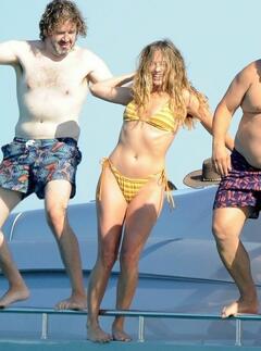 Margot Robbie seen in a bikini on a boat off the coast of Spain