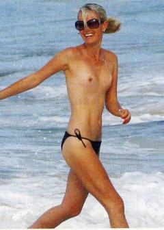 Laeticia Hallyday topless on a beach paparazzi photo