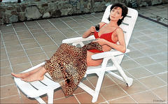 Russian actress Olga Drozdova sunbathing in red bikini