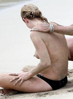 Kate Moss topless on a beach