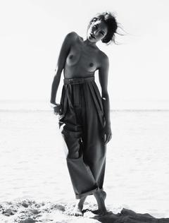 Lonneke Engel posing topless on a beach