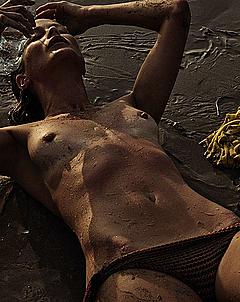 Carolyn Murphy lying topless
