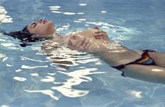 Alex Hanson topless in a water