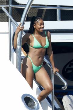 Gabrielle Union pokies in green bikini on a yacht in Sardinia
