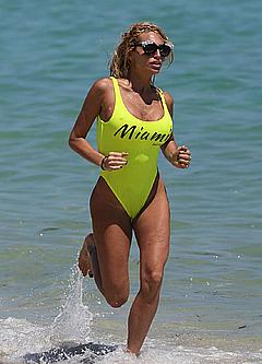 Vicky Xipolitakis in tight yellow swimsuit