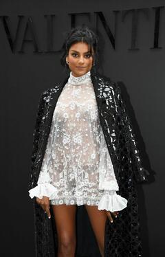 Simone Ashley brales in see through dress at Valentino Womenswear Spring∕Summer 2023 show during Paris Fashion Week