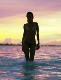 Alessandra Ambrosio topless in a water