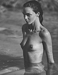Mariacarla Boscono nude in a water