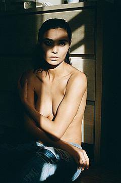 Melina Dimarco sitting braless cover her tits