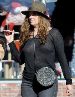 Actress Bijou Phillips braless in see through top