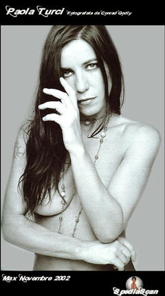 Paola Turci topless but covered for Max Magazine