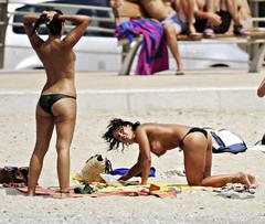 Nereida Gallardo and friends topless on a beach