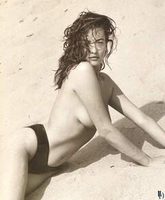 Tatjana Patitz topless on a beach