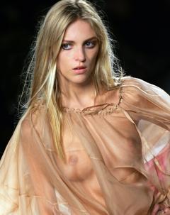 Anja Rubik in jeans and see through top runway image