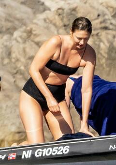 Maria Sharapova in black bikini on a boat in Nerano - September 2021
