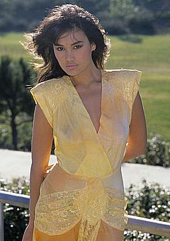 Tia Carrere in yellow dress early photo